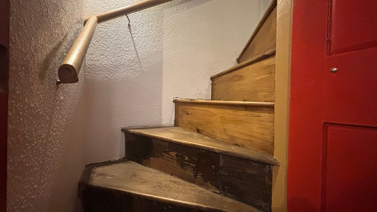 Steep stairs leading down to George Saunders tailor shop